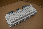 Smc Manifold Bank W/ (10) Solenoid Valves SY5200-5U1 SY5100-5U1. Fixed Price $450.00.